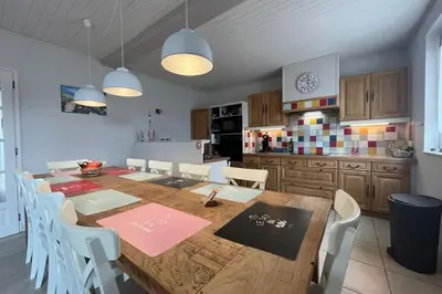 a kitchen with a large wooden table with white chairs at Le Villerouge - 14 Personnes - Piscine in Fabrezan