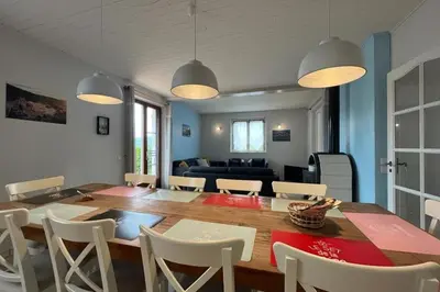 a dining room and living room with a table and chairs at Le Villerouge - 14 Personnes - Piscine in Fabrezan