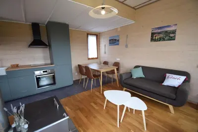 a living room with a couch and a table at Le Villerouge - 14 Personnes - Piscine in Fabrezan
