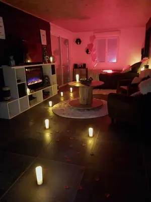 a living room with candles on the floor at Le Clos FMR - Romain in Malves-en-Minervois