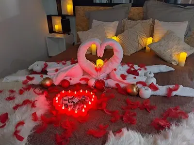 a bed with a heart made out of red roses at Le Clos FMR - Romain in Malves-en-Minervois