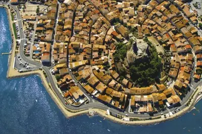 an aerial view of a city next to the water at Maison au cœur du village de Gruissan in Gruissan