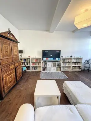 a living room with a couch and a tv at L'écrin Lauragais - Grande maison, 3 chambres 3sdb in Villefranche-de-Lauragais