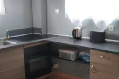 a kitchen with a sink and a counter top at Repos en campagne in Pexiora