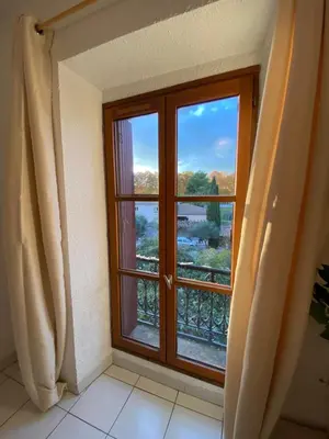 a window in a room with a view at Au pied de la cité, T3 au calme in Carcassonne