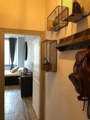 a room with a hallway with a room with a room at Studio au pied de la cité in Carcassonne