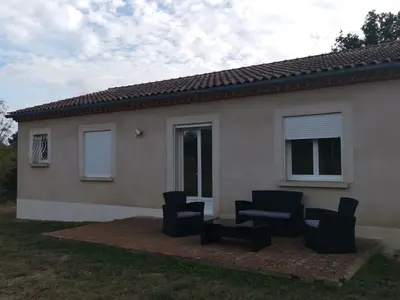 a group of chairs sitting in front of a house at La Maison du Bagas, 7pers in Vielmur-sur-Agout