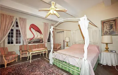 a bedroom with a bed and a ceiling fan at Nice Home In Ventenac-En-Minervois in Ventenac en Minervois