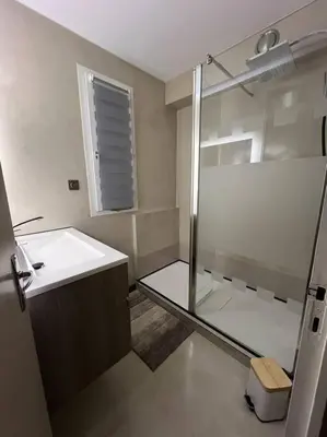 a bathroom with a shower and a sink at Plumes Résidence de l’Agout in Castres