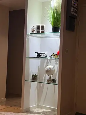 a room with shelves with plants and other items at Plumes Résidence de l’Agout in Castres