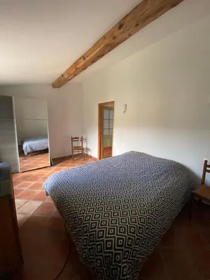 a bedroom with a bed in a room at Domaine de Gourgounet gîte à la ferme, Gite de groupe 25 couchages avec piscine privative in Villefloure