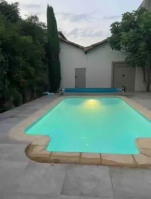 a large swimming pool in a yard at The Forge Esperaza in Espéraza