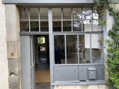 a person standing in the doorway of a building at The Forge Esperaza in Espéraza