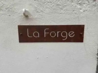 a sign on a wall that reads la force at The Forge Esperaza in Espéraza