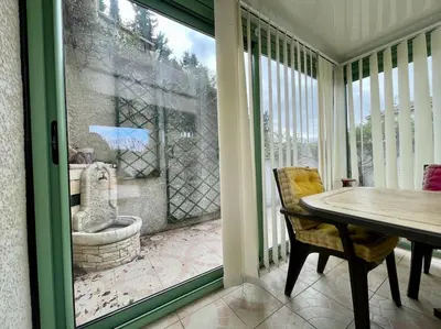 a kitchen with a white refrigerator and a window at Villa Anatole - parking privé - 900m Cité Médiévale in Carcassonne
