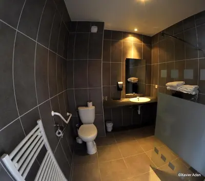 a bathroom with a toilet and a sink at Douce France in Cuxac-dʼAude