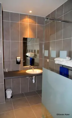 a bathroom with a sink and a mirror at Douce France in Cuxac-dʼAude
