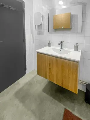 a bathroom with a sink and a mirror at Le Petit Paradis de Carcassonne in Carcassonne