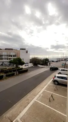 two people are playing in a parking lot at La terrasse de Gruissan in Gruissan