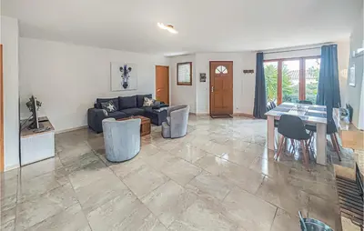 a living room with a couch and a table at Pet Friendly Home In Pouzols-Minervois in Pouzols-Minervois