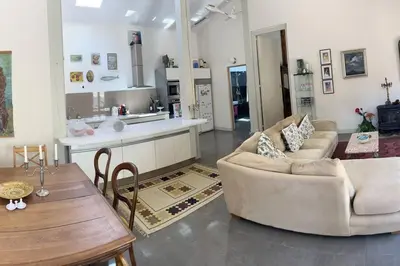 a living room with two couches and a table at The hat factory in Espéraza