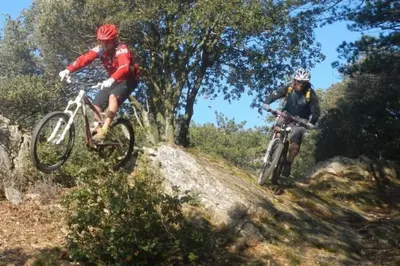 two people riding dirt bikes on a trail at Chalet, calme, absolu, superbe vue, et piscine (en été) in Ventenac-Cabardès