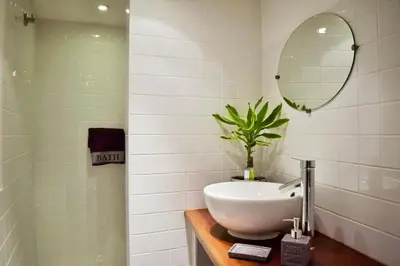 a bathroom with a sink and a mirror at Maison chaleureuse près de lagrasse corbières in Saint-Pierre-des-Champs