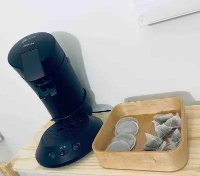 a black mixer sitting next to a tray of rocks at Le P'tit Stud' in Castres