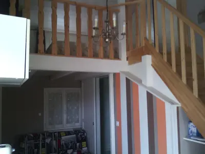 a staircase with orange and white stripes in a room at Le Cabanon in Lacrouzette