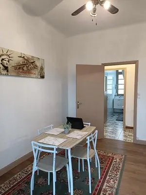 a dining room with a table and chairs at Spacious Luxury 2 bed appartment in Carcassonne