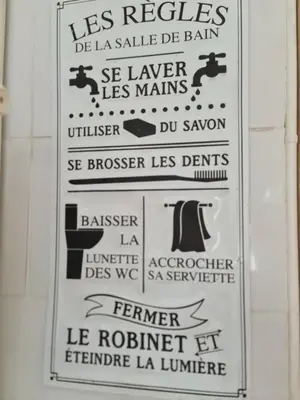 a sign on a wall in a bathroom at Spacious Luxury 2 bed appartment in Carcassonne