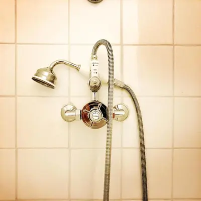 a shower in a bathroom with a shower head at B&B Vigne Vierge in Aigne