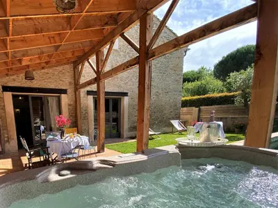 a swimming pool in the backyard of a house at Gîte de caractère La Grange Saint Papoul in Saint-Papoul