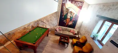 an overhead view of a living room with a pool table at jolie maison avec terrasse in Cessenon