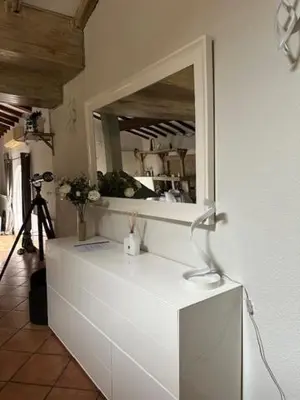 a mirror on top of a dresser in a room at Belle Lauragaise ensoleillée in Issel