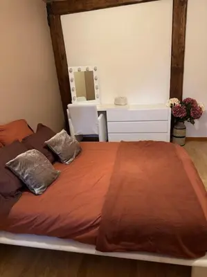 a bed with two pillows on it in a bedroom at Belle Lauragaise ensoleillée in Issel