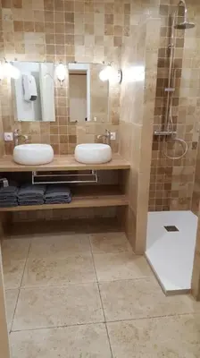 a bathroom with two sinks and a shower at Belle Lauragaise ensoleillée in Issel