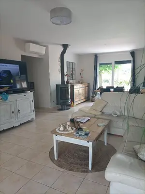 a living room with a couch and a coffee table at Chambre calme dans une maison à la campagne in Vielmur-sur-Agout