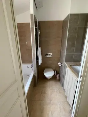 a bathroom with a toilet and a tub and a sink at Maison Kokopetit - Dans les Corbières in Saint-Laurent-de-la-Cabrerisse