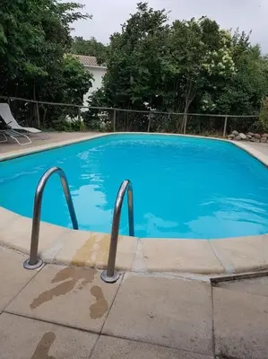 a large blue swimming pool in a yard at Sigean - Maison domaine viticole, 6 km de la mer in Sigean
