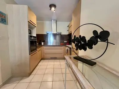 a kitchen with a bunch of pots and pans on the wall at Le Verdun N°38 - 70m2 - Carcassonne hyper-centre in Carcassonne