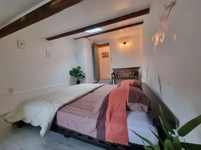 a bedroom with a large bed in a room at Jolie Villa piscine à 15 min du Barcarès in Salses-le-Chateau