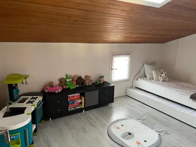 a bedroom with a bed and stuffed animals in it at Jolie Villa piscine à 15 min du Barcarès in Salses-le-Chateau