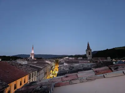 a view of a city from the roofs of buildings at La terrasse des Augustins in Limoux
