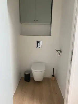 a bathroom with a toilet in the corner of a room at Magnifique appartement T2 en Centre VILLAGE in Saverdun