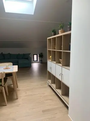 a living room with a couch and a table at Magnifique appartement T2 en Centre VILLAGE in Saverdun