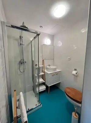 a bathroom with a shower and a toilet and a sink at O'mA Style in Carcassonne