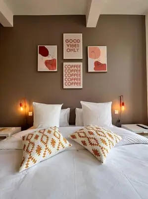 a large white bed with two pillows on it at O'mA View in Carcassonne