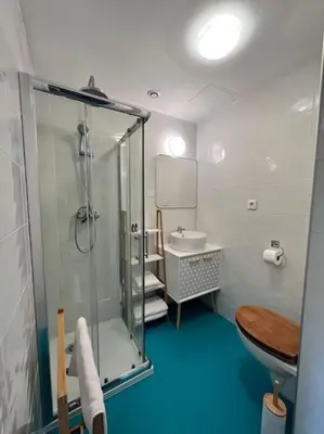 a bathroom with a shower and a sink at O'mA View in Carcassonne