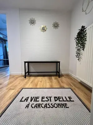 a living room with a rug on the floor at O'mA View in Carcassonne
